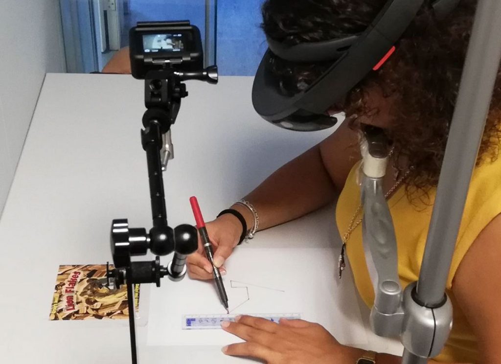 A series of experiments tested how augmented reality (AR) affects participants’ ability to simultaneously focus on real-world objects (the paper and a pen) and a "connect-the-dots" task projected in front of their eyes via a Microsoft HoloLens.